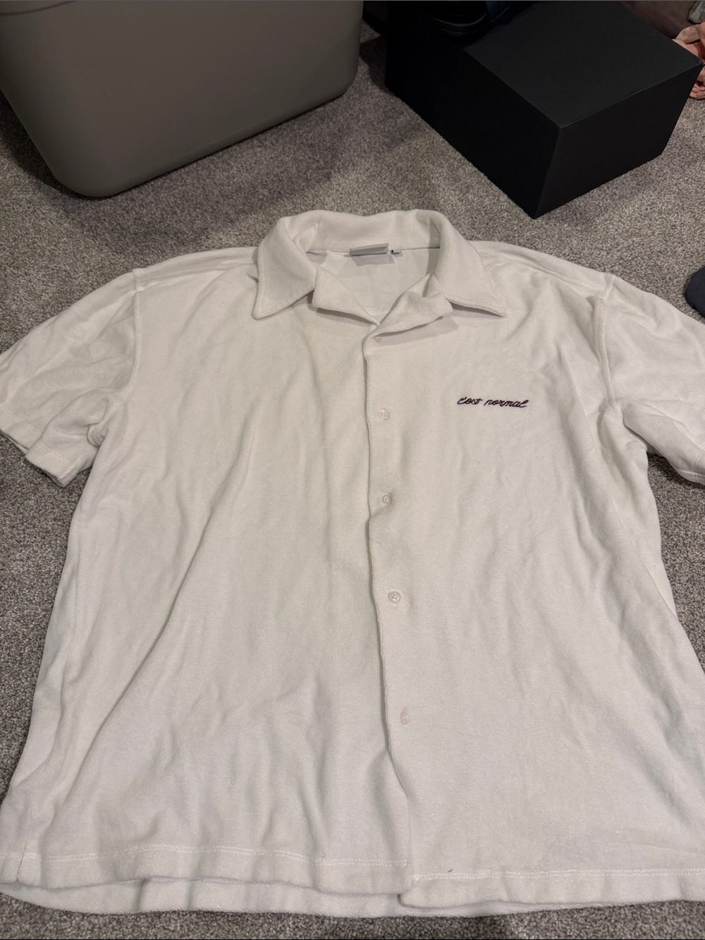 Men's White Short-Sleeve Button Polo with Subtle Chest Script